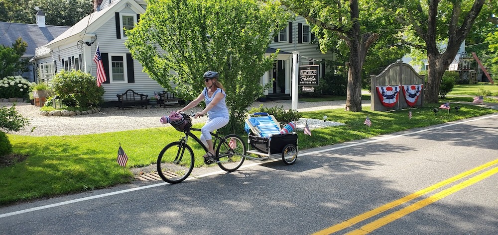 Enjoy the Best of Cape Cod in October 1 Woman riding down a bike trail on Cape Cod in October
